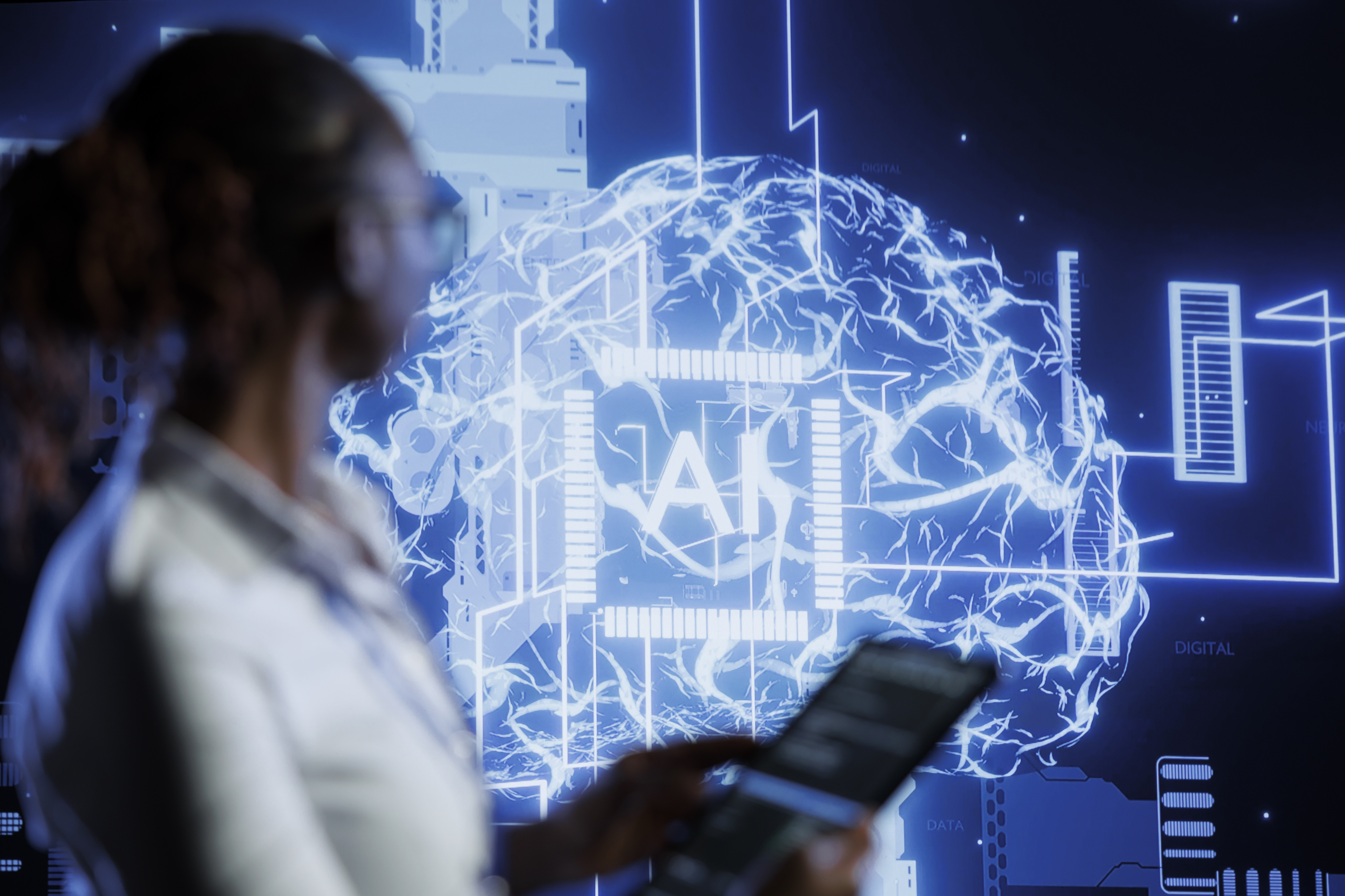 Women looking at screen with AI in center of brain