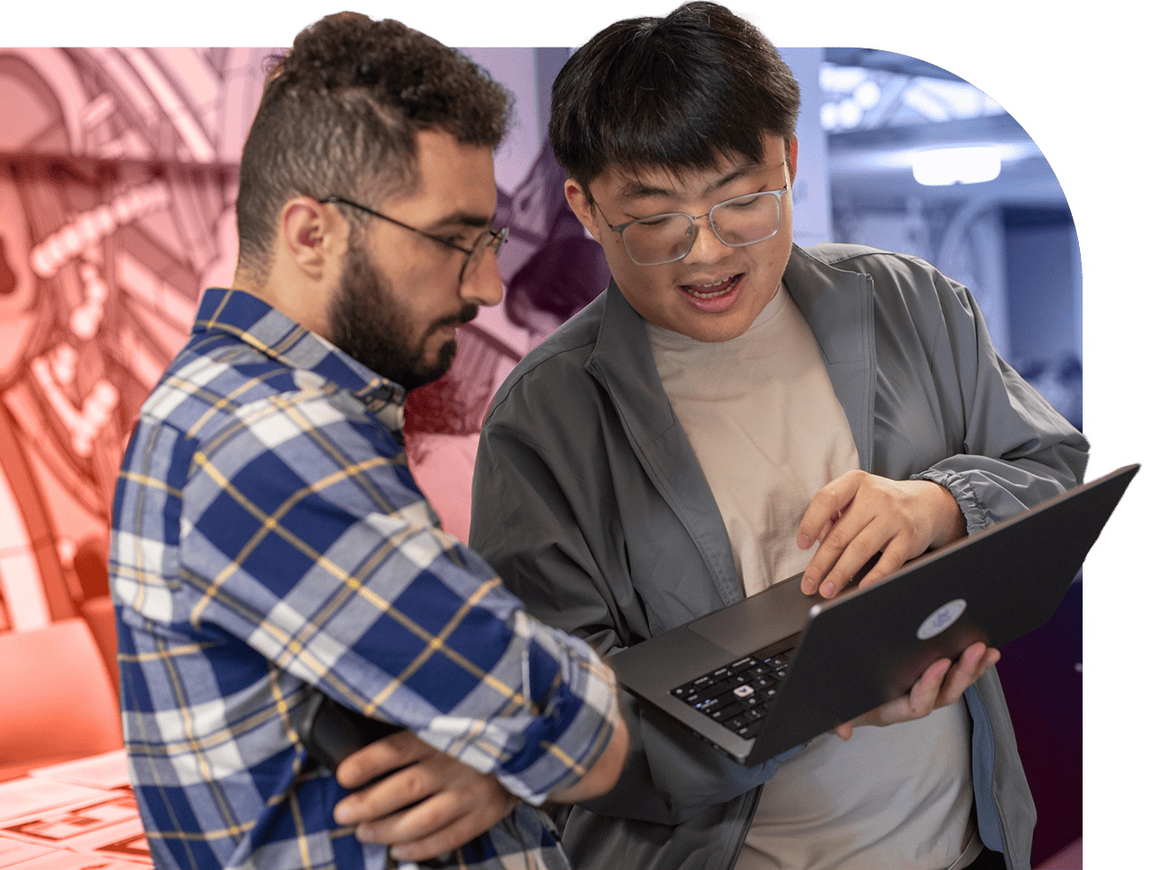 two people looking at computer